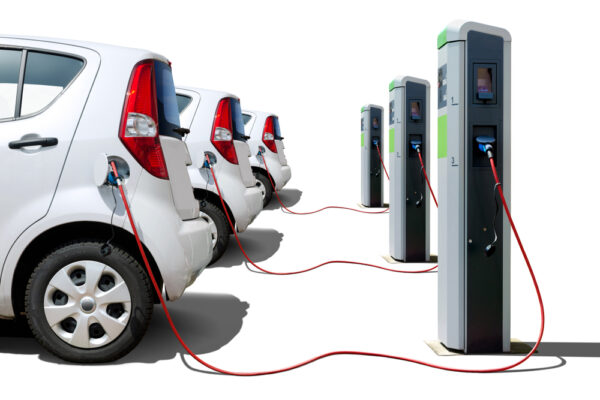 Many,Electric,Cars,On,Charging,Station,Isolated,On,White,,Electric